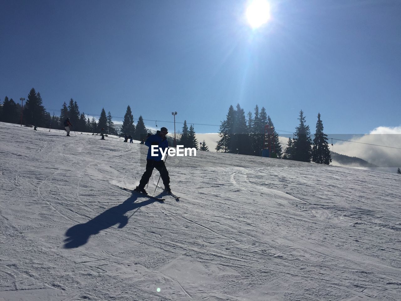 FULL LENGTH OF MAN ON SNOW COVERED FIELD