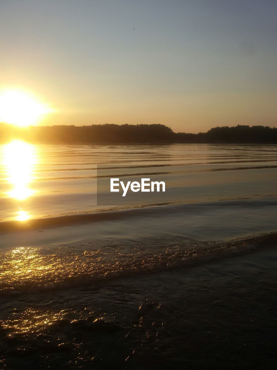 Scenic view of sunset over river