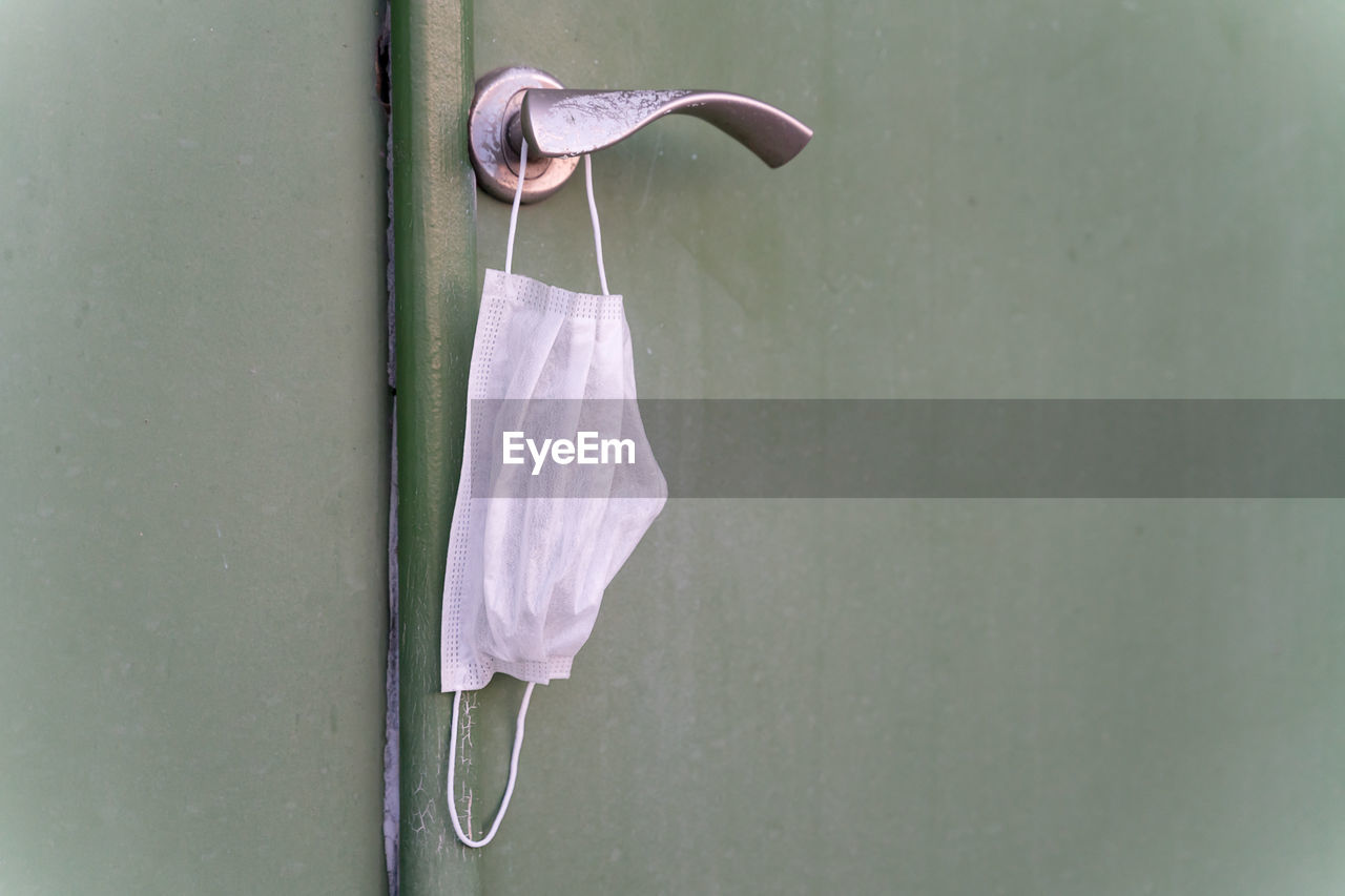 Close-up of medicine mask hanging on wall