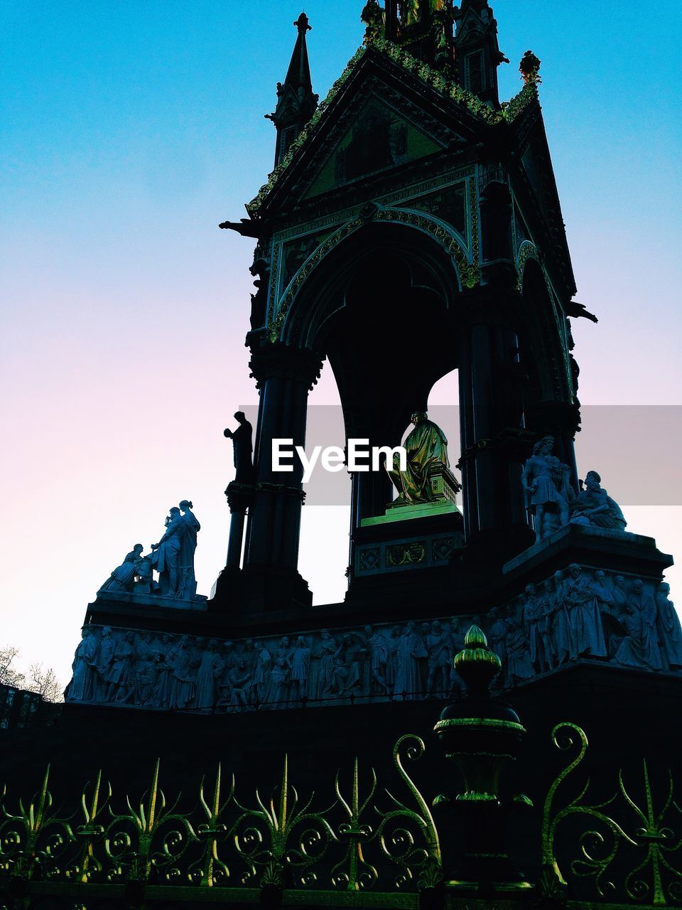 Low angle view of albert memorial against clear sky during dusk