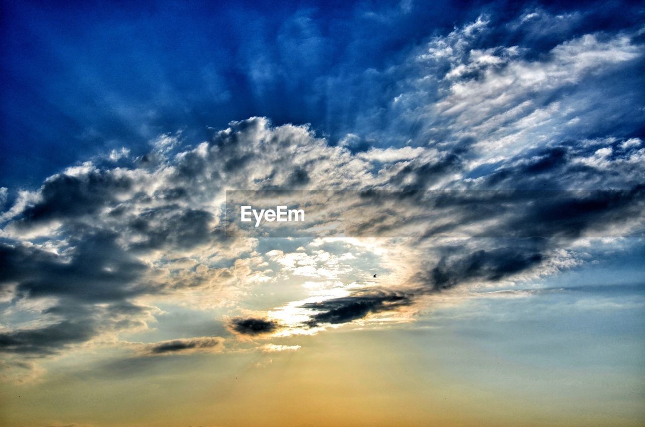 Low angle view of dramatic sky at dusk