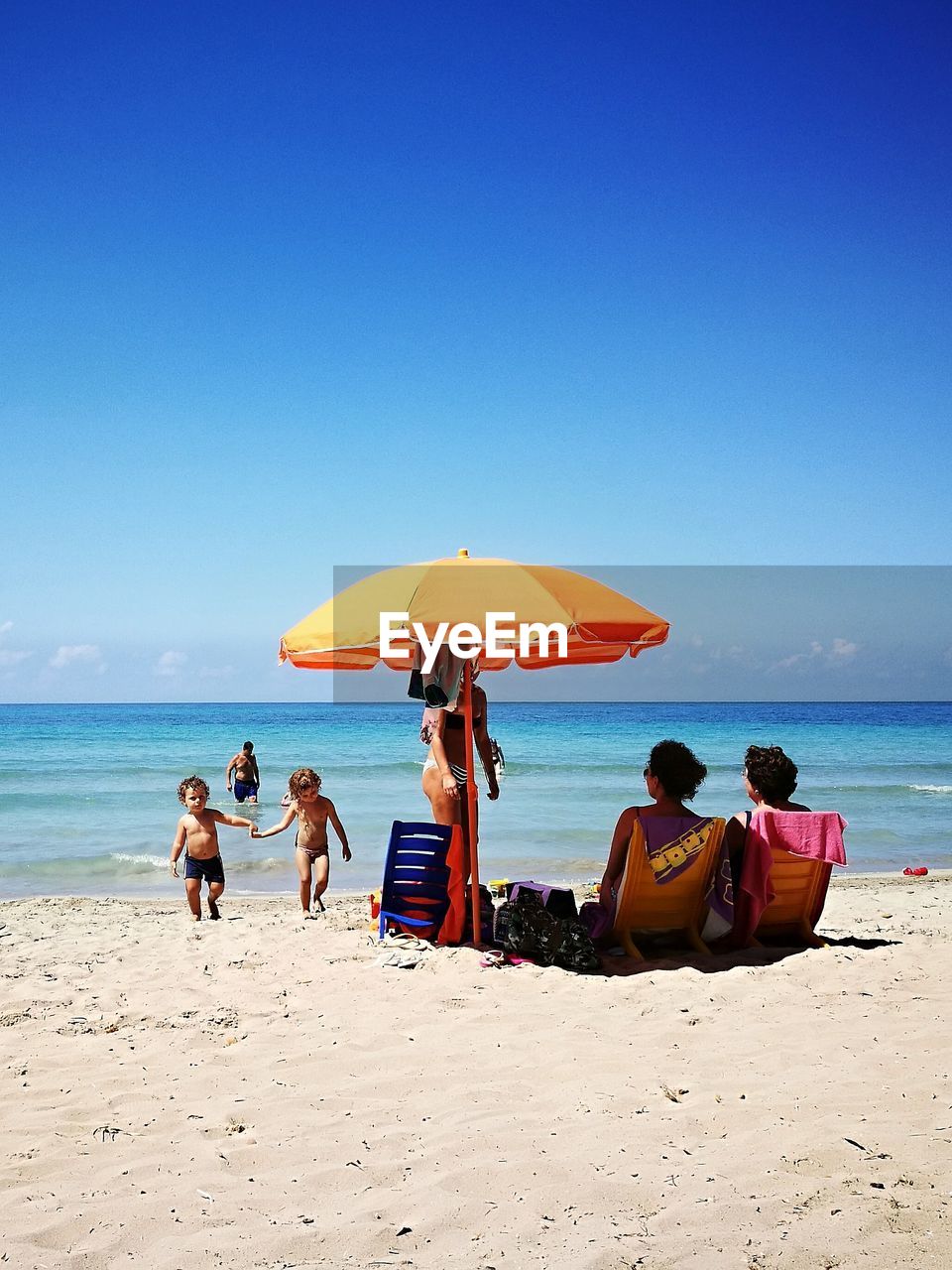 TOURISTS ENJOYING AT BEACH