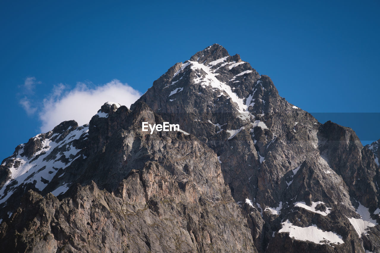 View of the himalayan peaks. close-up of a secluded mountain peak with snow on a sunny clear day