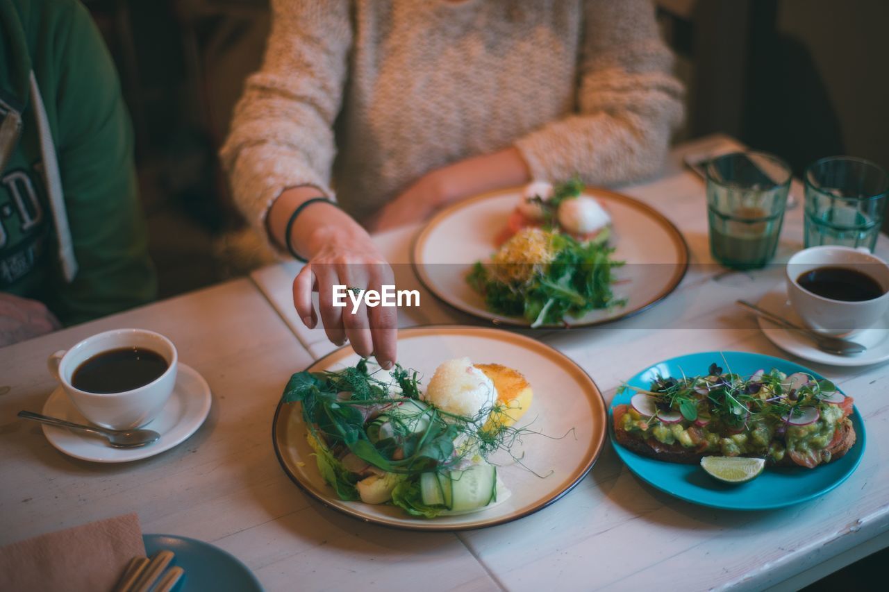 Midsection of woman having food