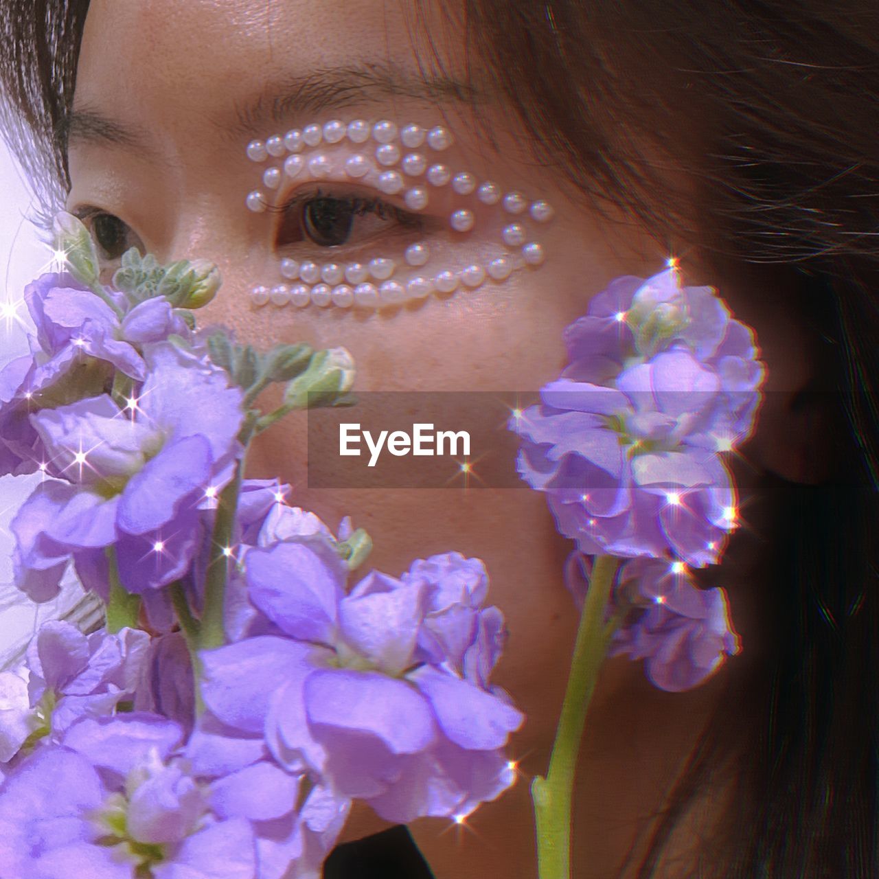 Close-up of woman with flowers