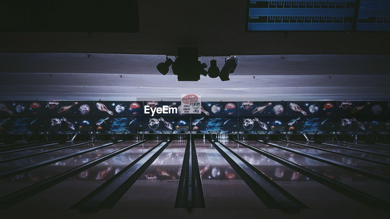 Empty illuminated bowling alley