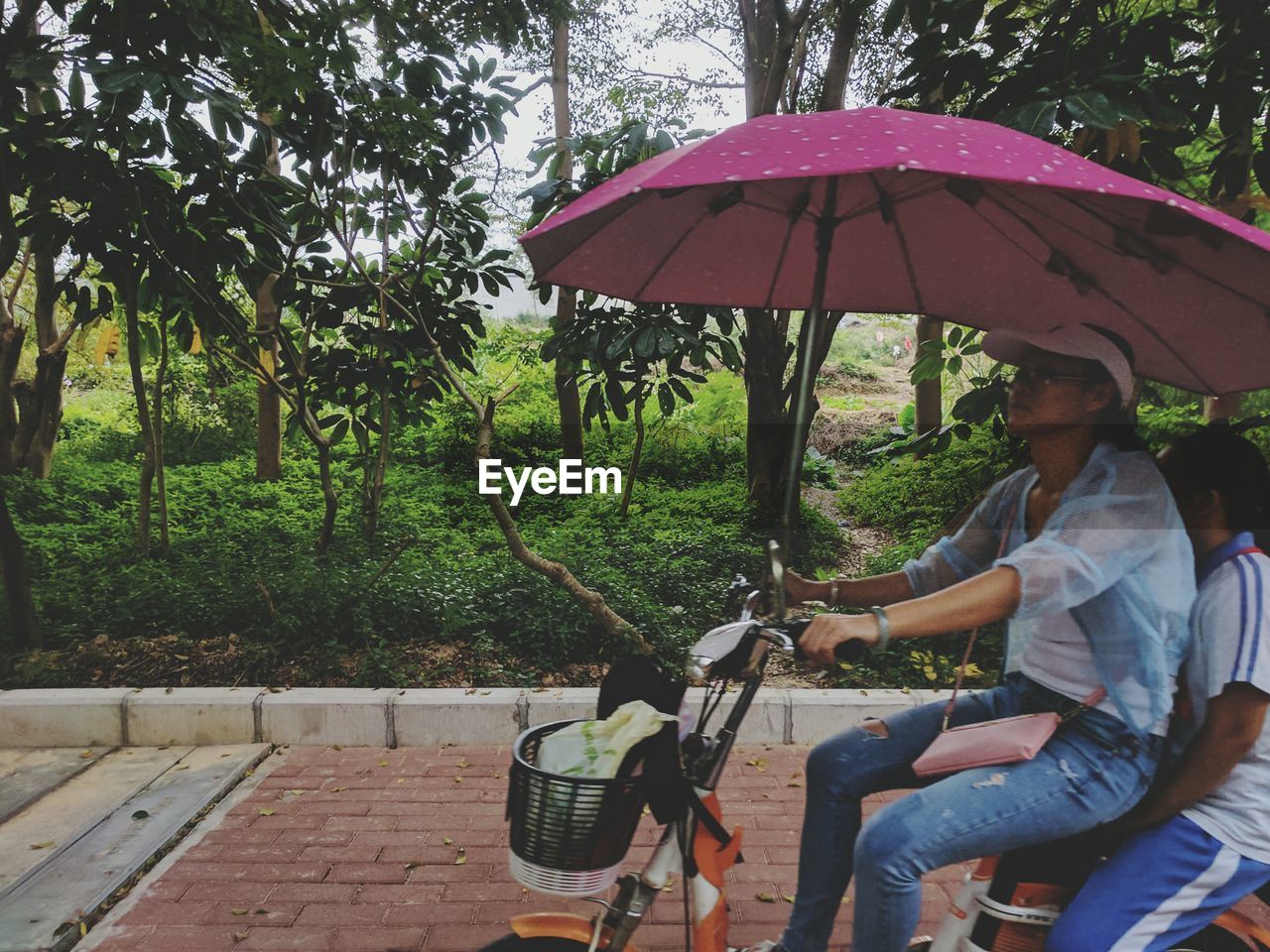 PEOPLE SITTING ON BICYCLE