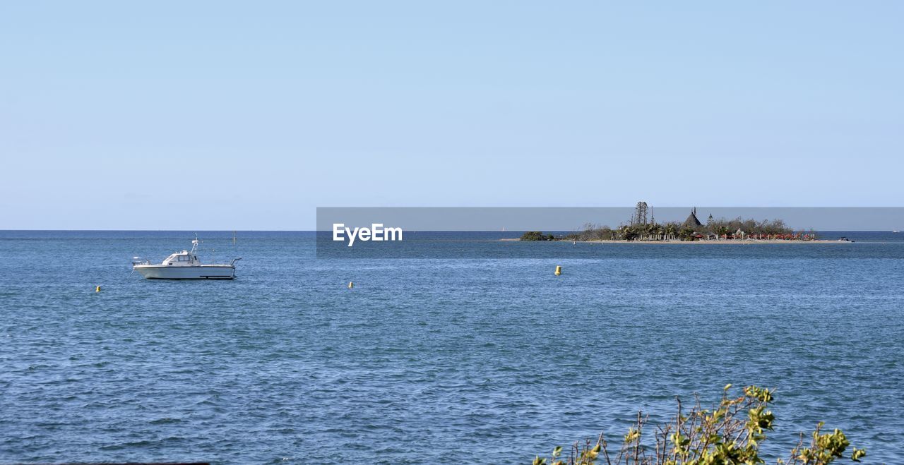 Scenic view of sea against clear sky