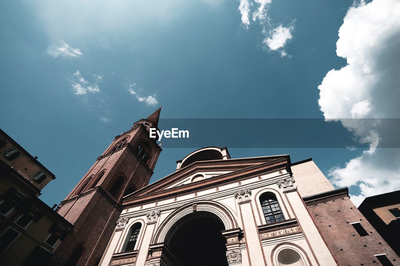 LOW ANGLE VIEW OF CATHEDRAL AGAINST SKY AND BUILDINGS