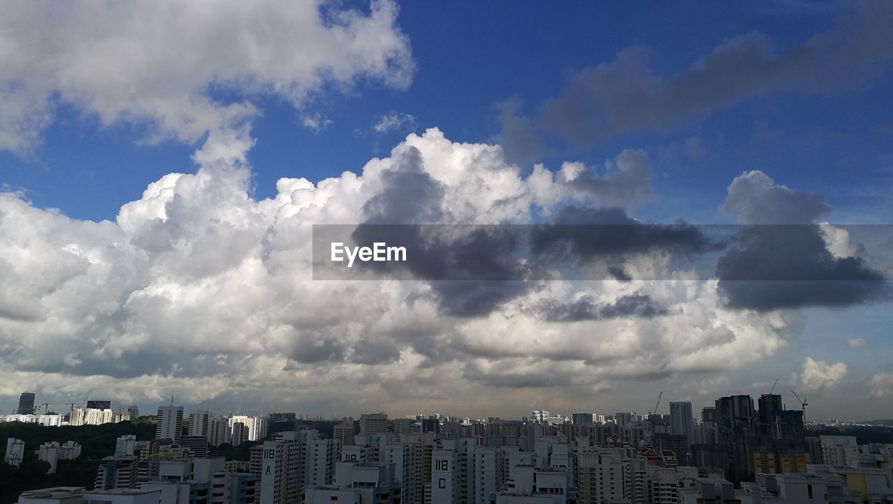 Buildings in city against sky