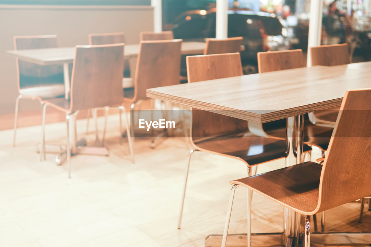 Empty chairs and tables in cafe