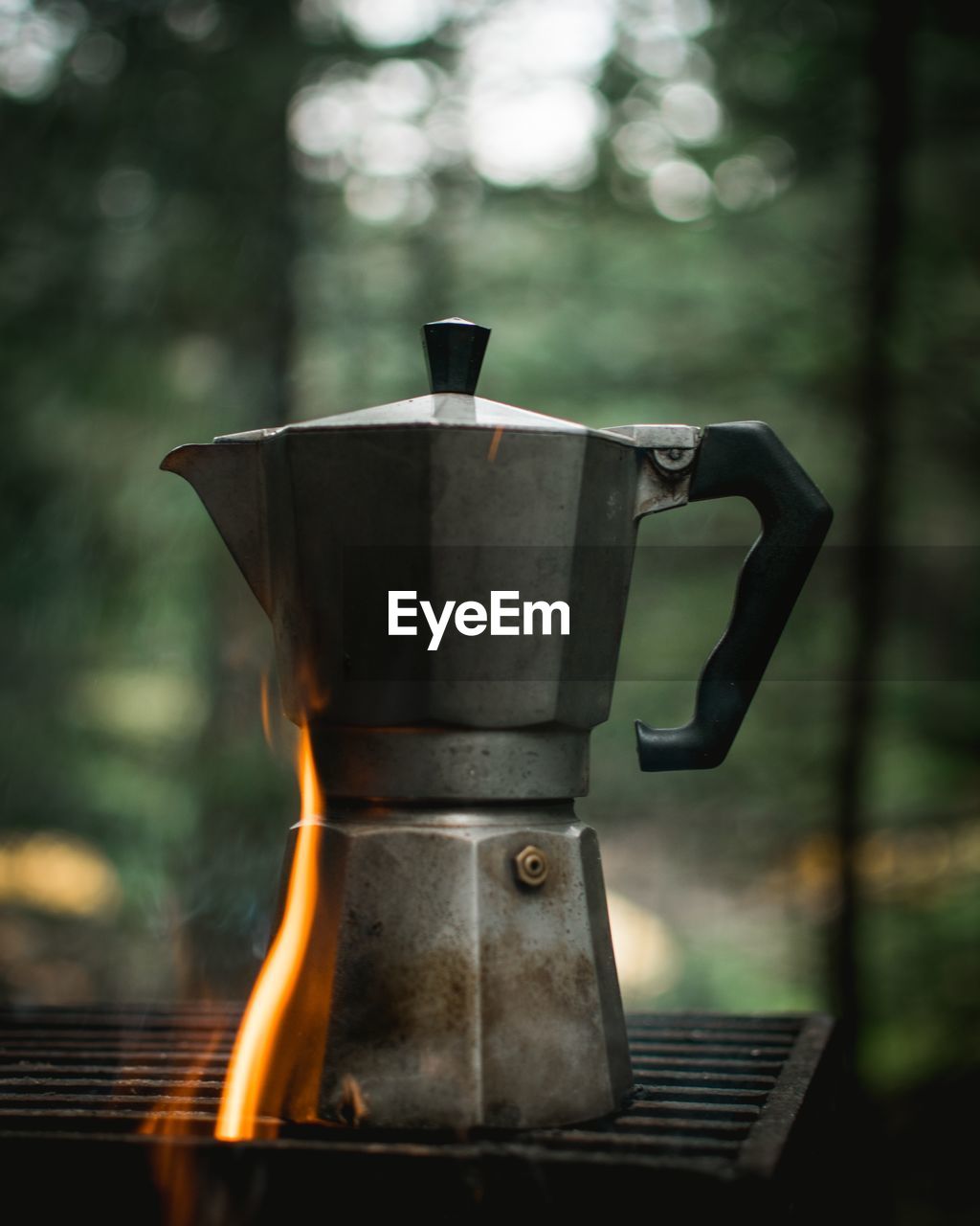 Close-up of coffee cup on barbecue grill