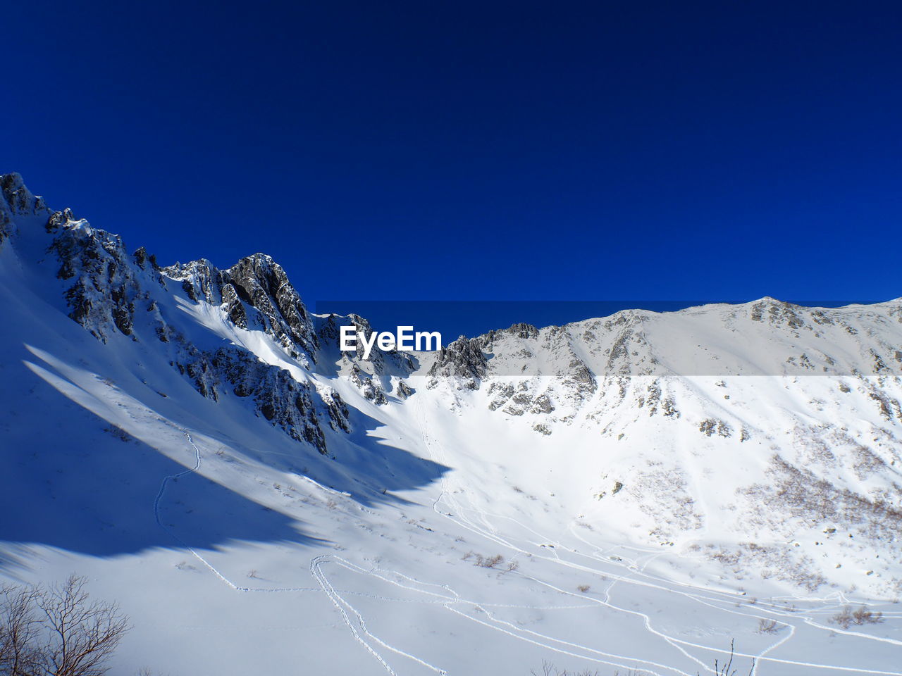 Scenic view of snowcapped mountain against sky