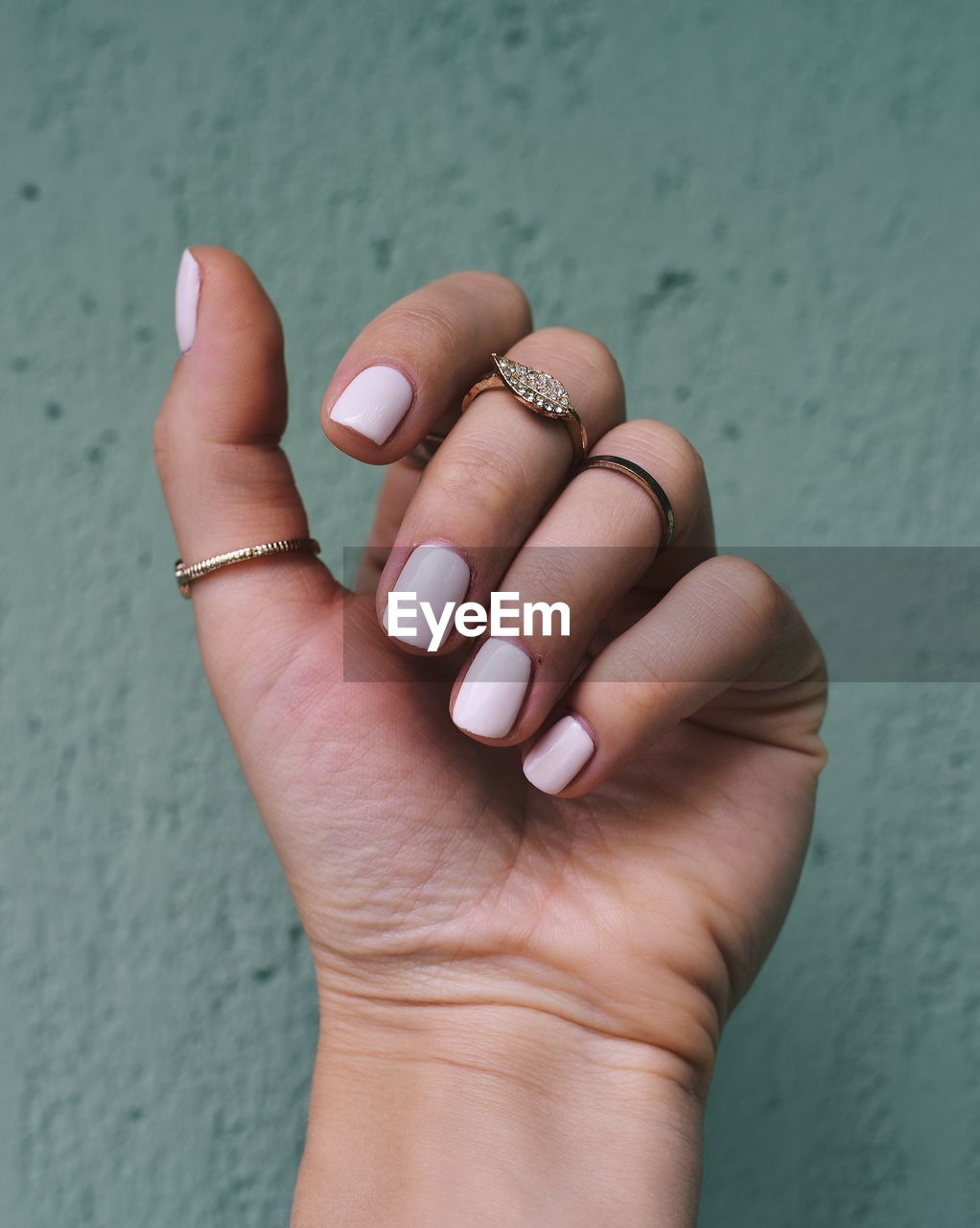 Close-up of woman hand with manicure and jewelry 