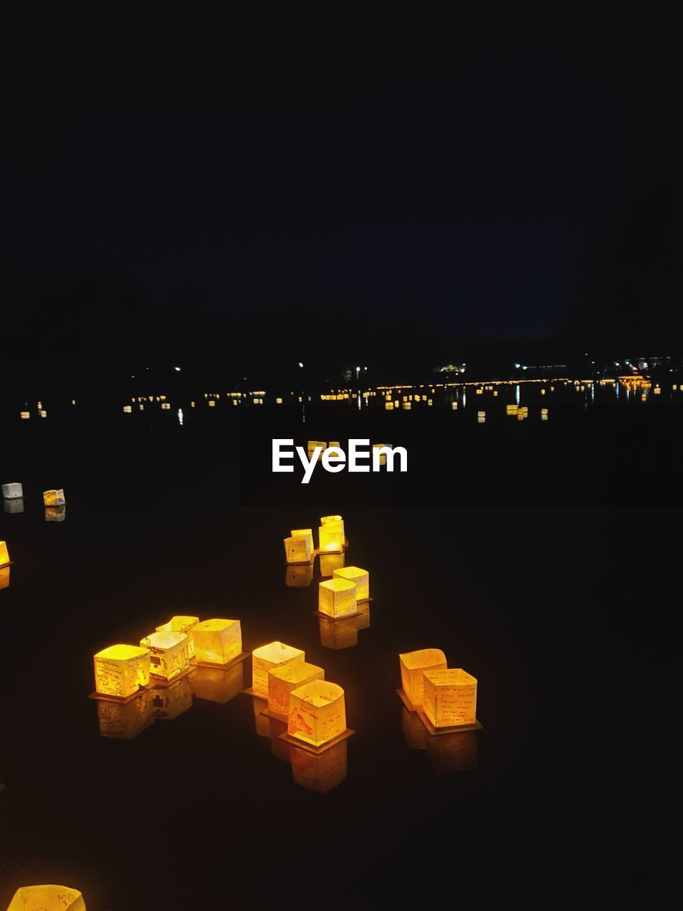 ILLUMINATED BUILDINGS AGAINST SKY AT NIGHT