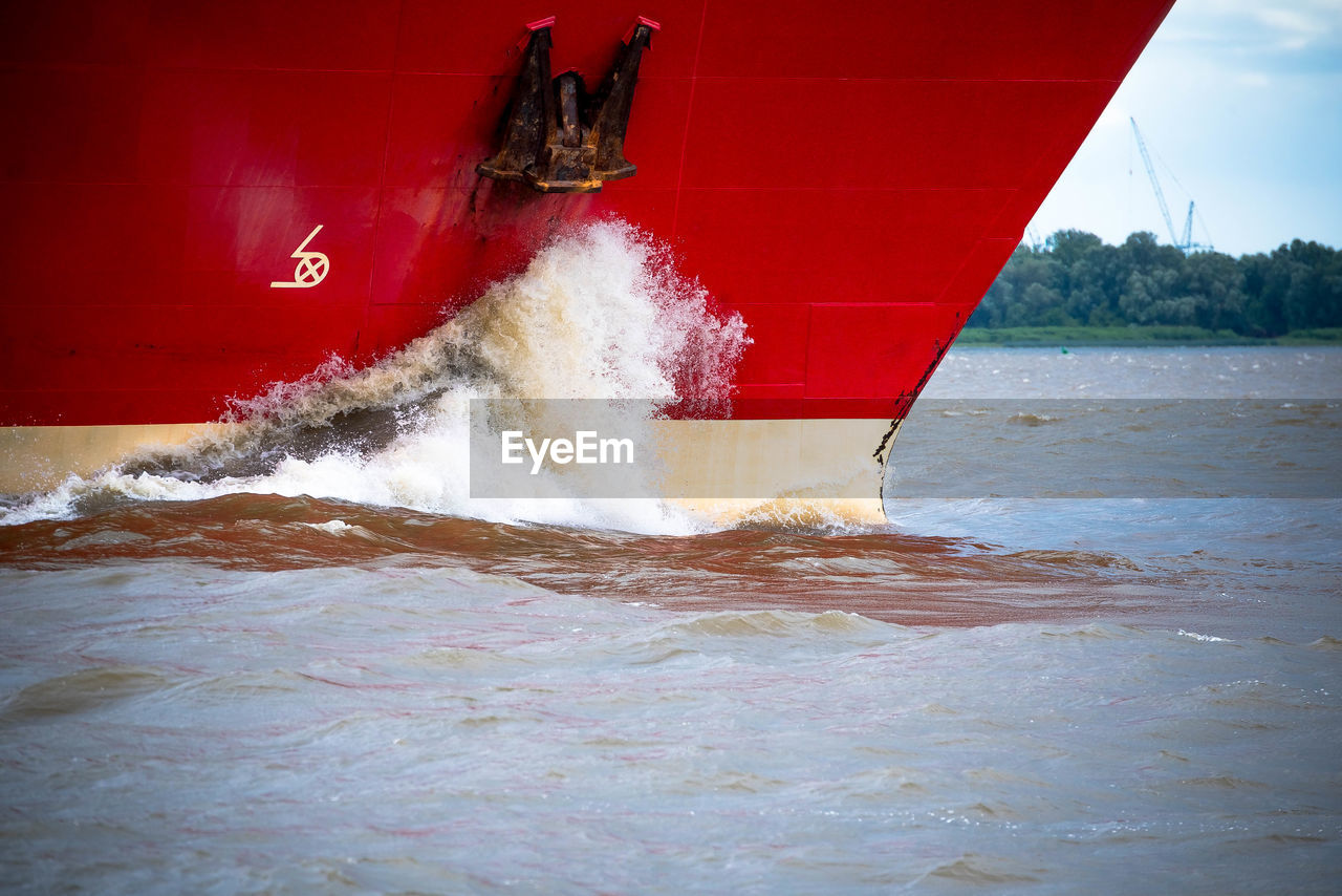 Water splashing on boat in sea