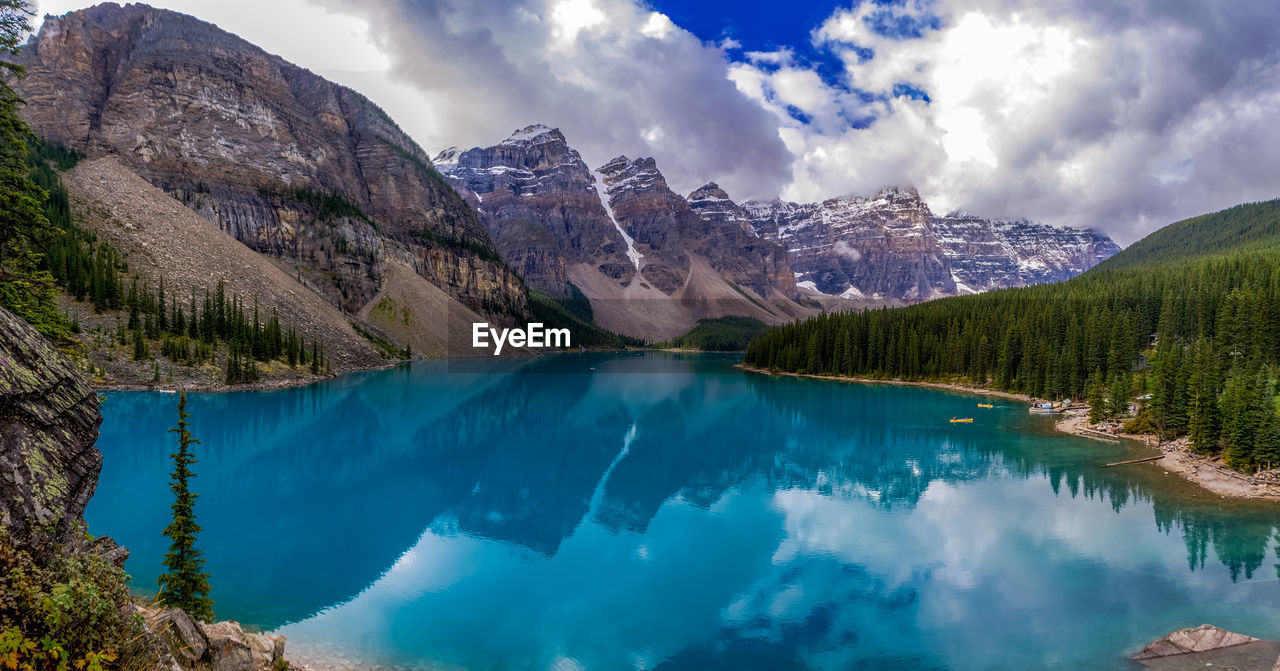 Panoramic view of lake and mountains against sky at moraine lake
