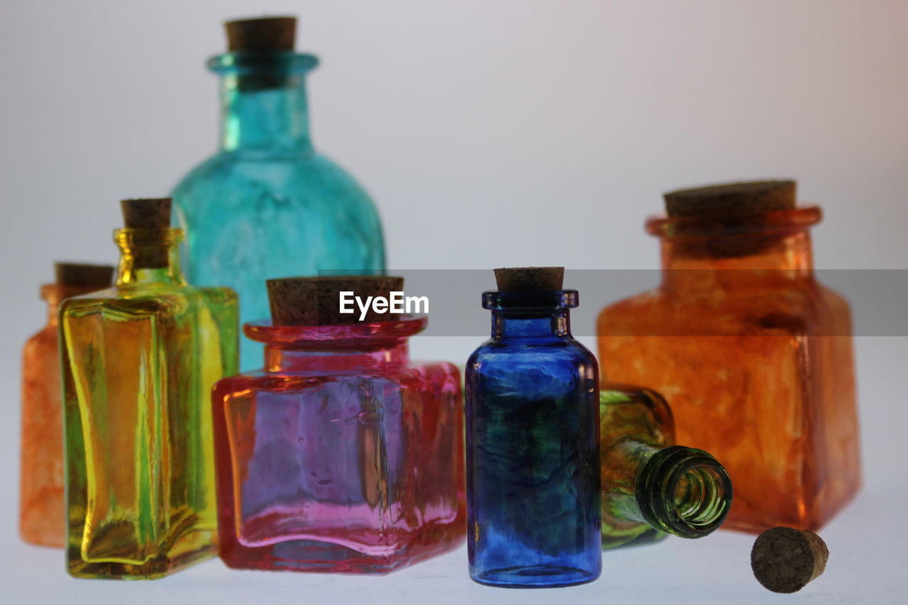 Close-up of colorful glass bottles on table