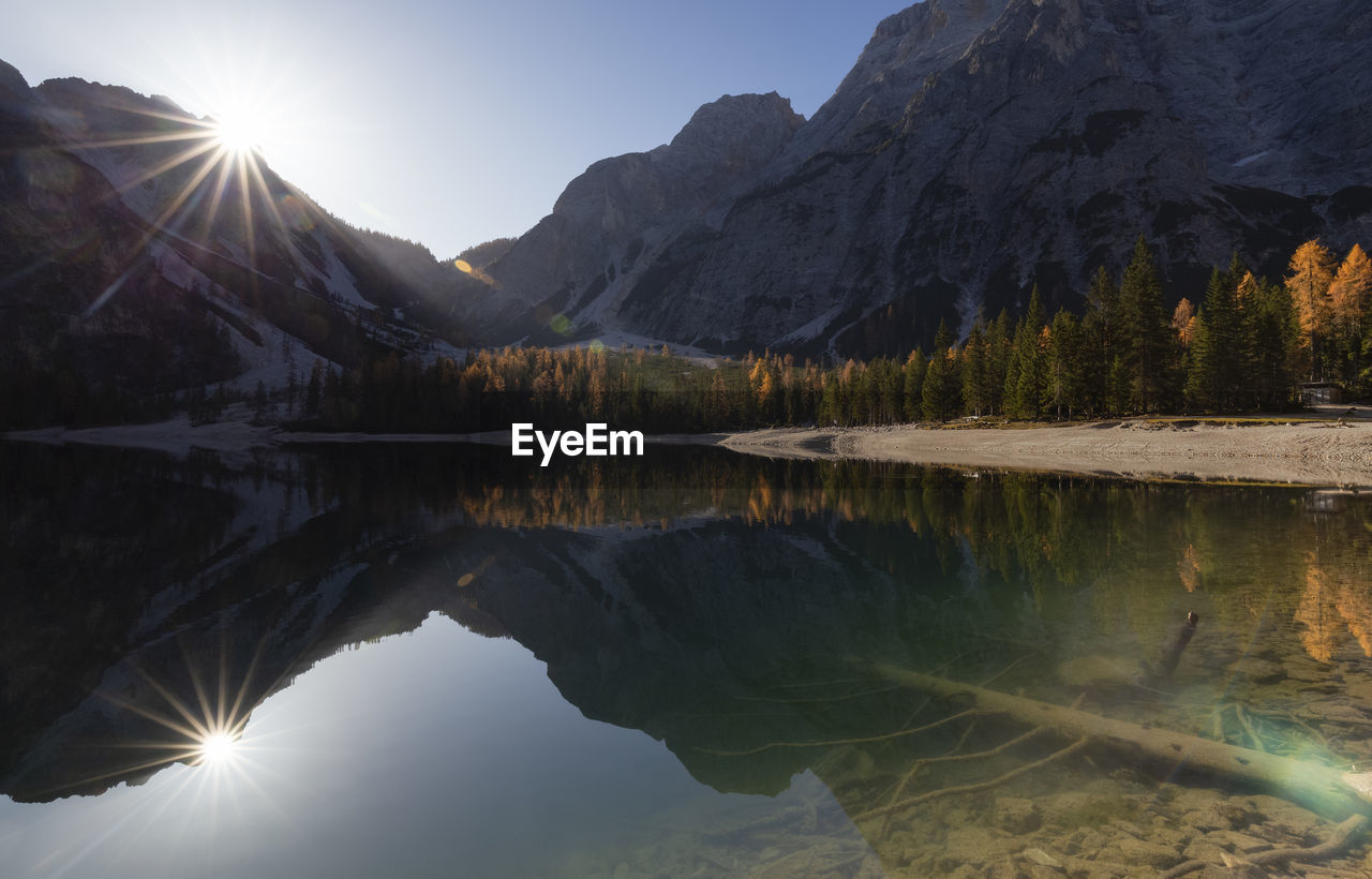 Scenic view of lake and mountains against sky