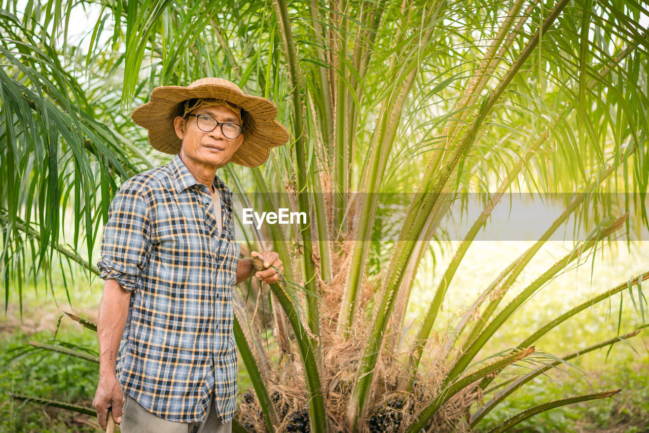 Portrait of farmer standing in farm