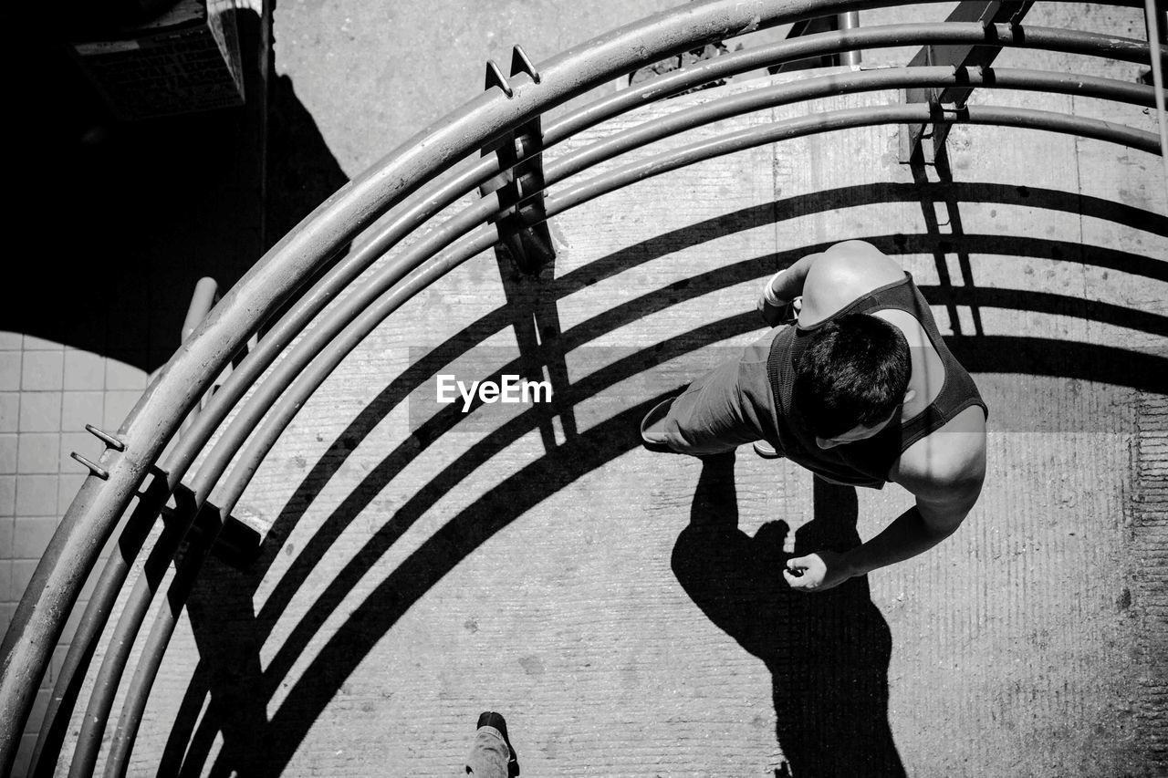 Directly above shot of man by fence