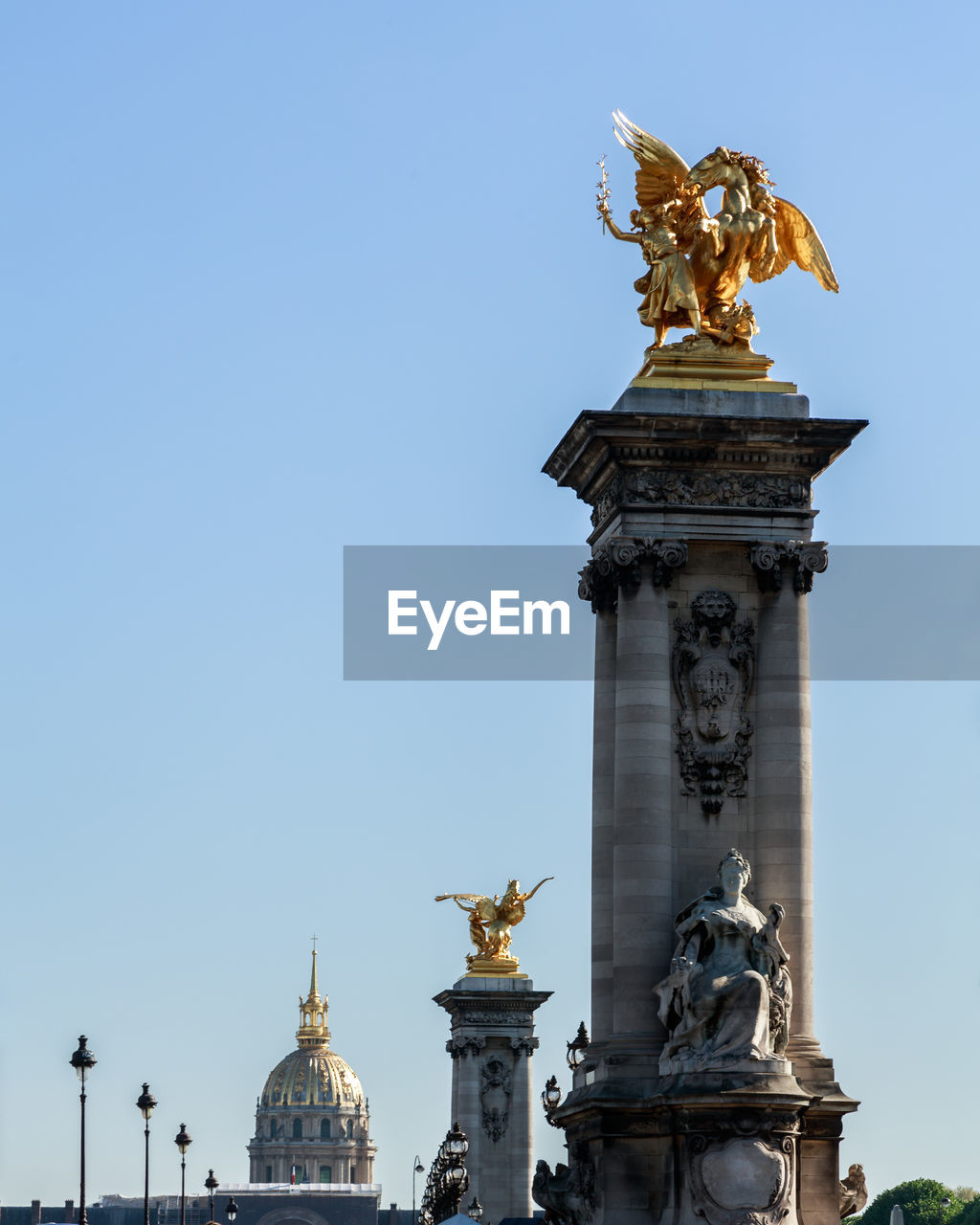 Statue in paris against clear sky