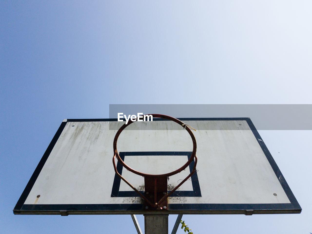 Low angle view of basketball hoop against clear sky