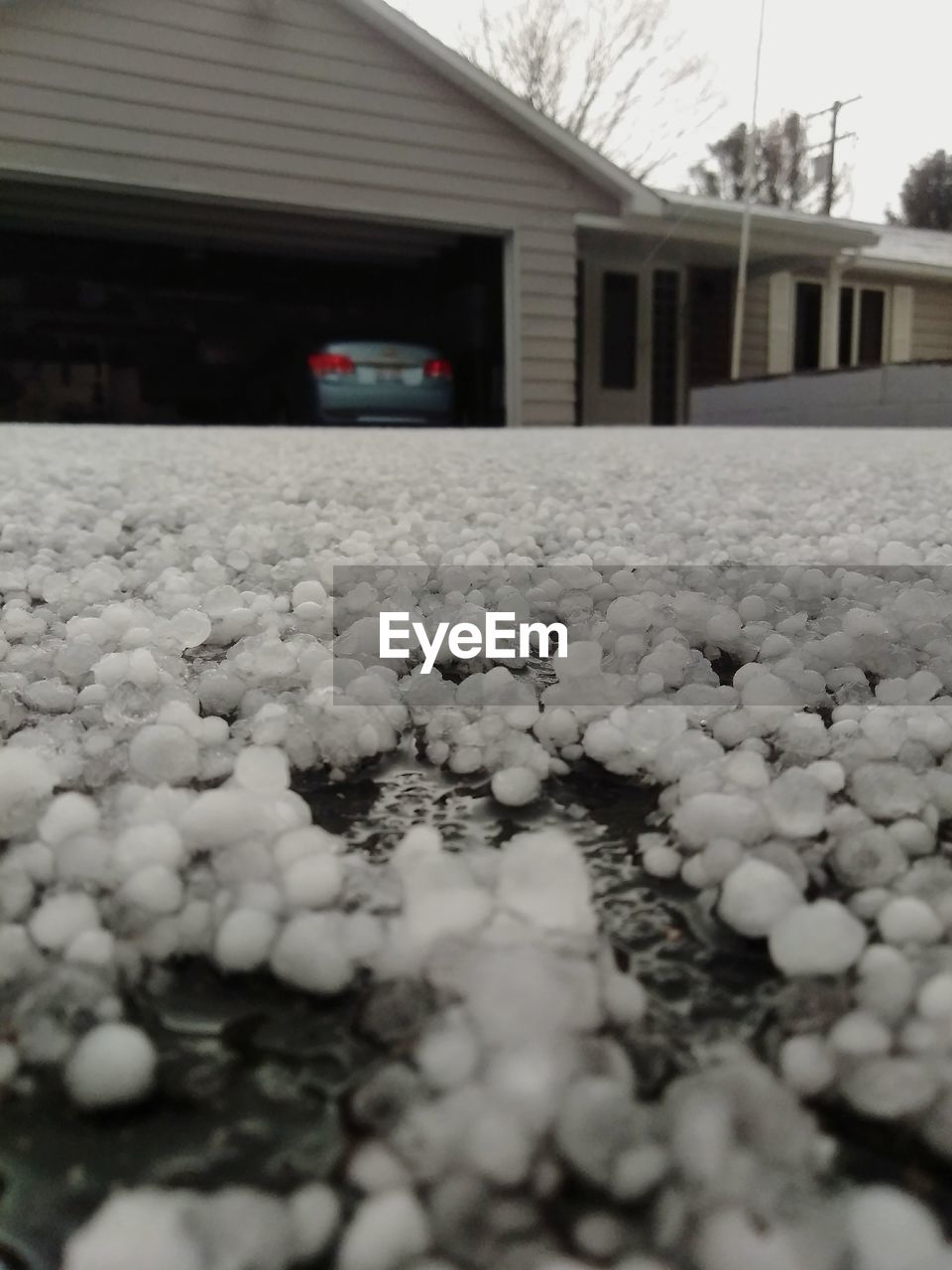 SURFACE LEVEL OF SNOW COVERED PEBBLES