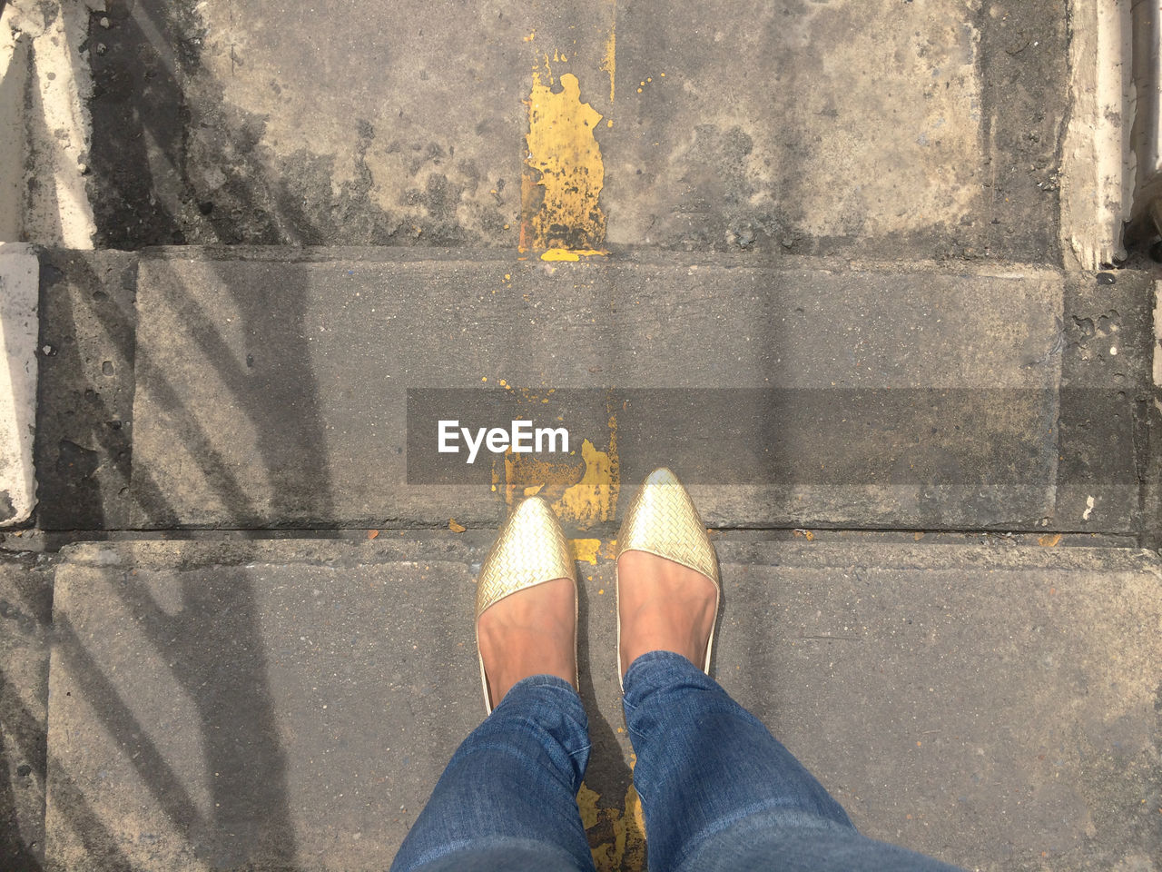 Low section of woman standing on steps