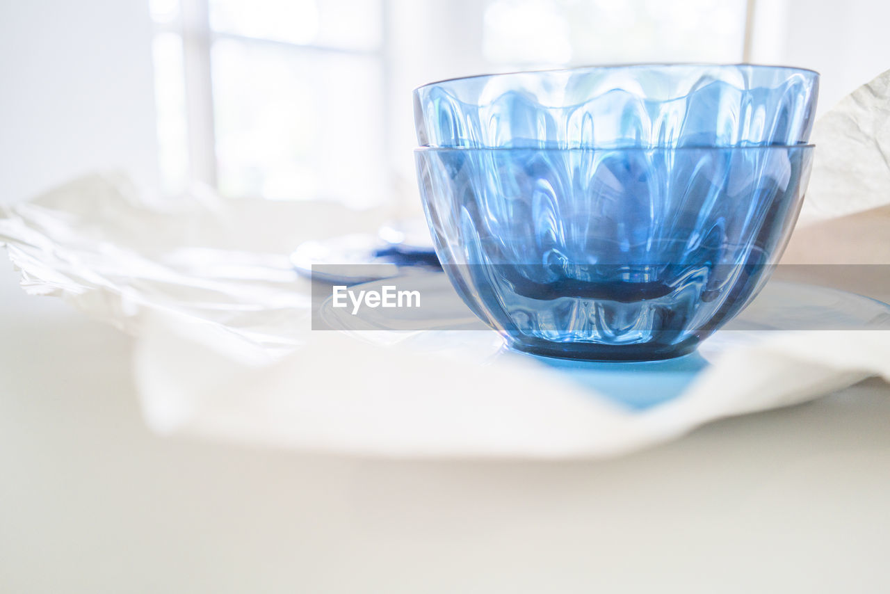 CLOSE-UP OF WINEGLASS ON TABLE