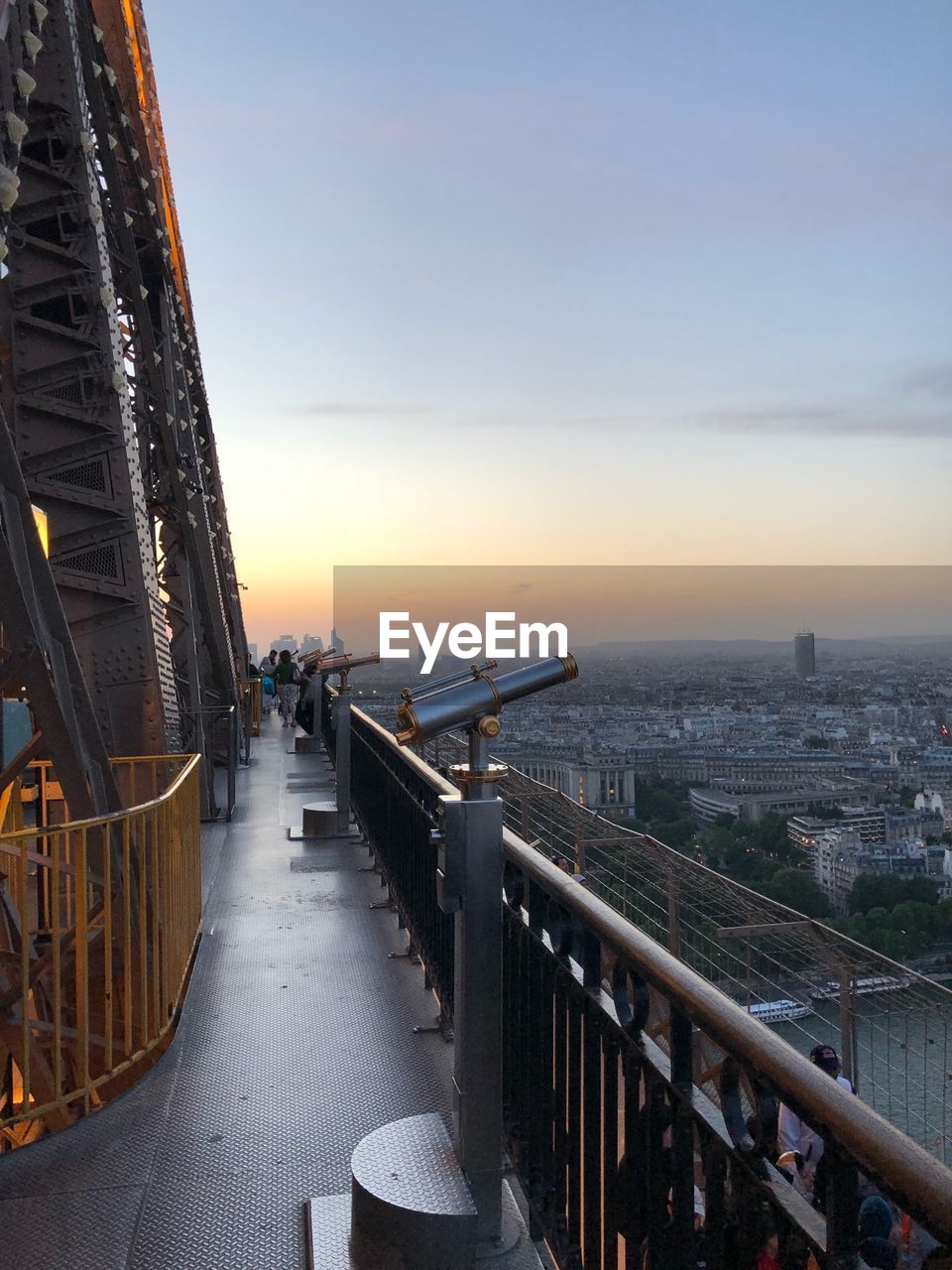 Paris at eiffel tower against sky during sunset