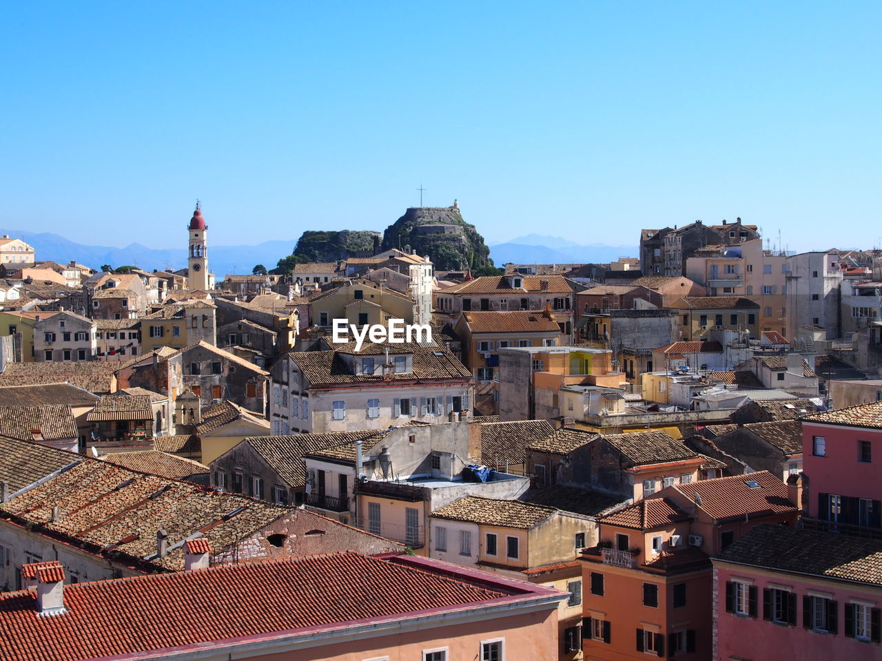 View of cityscape against blue sky