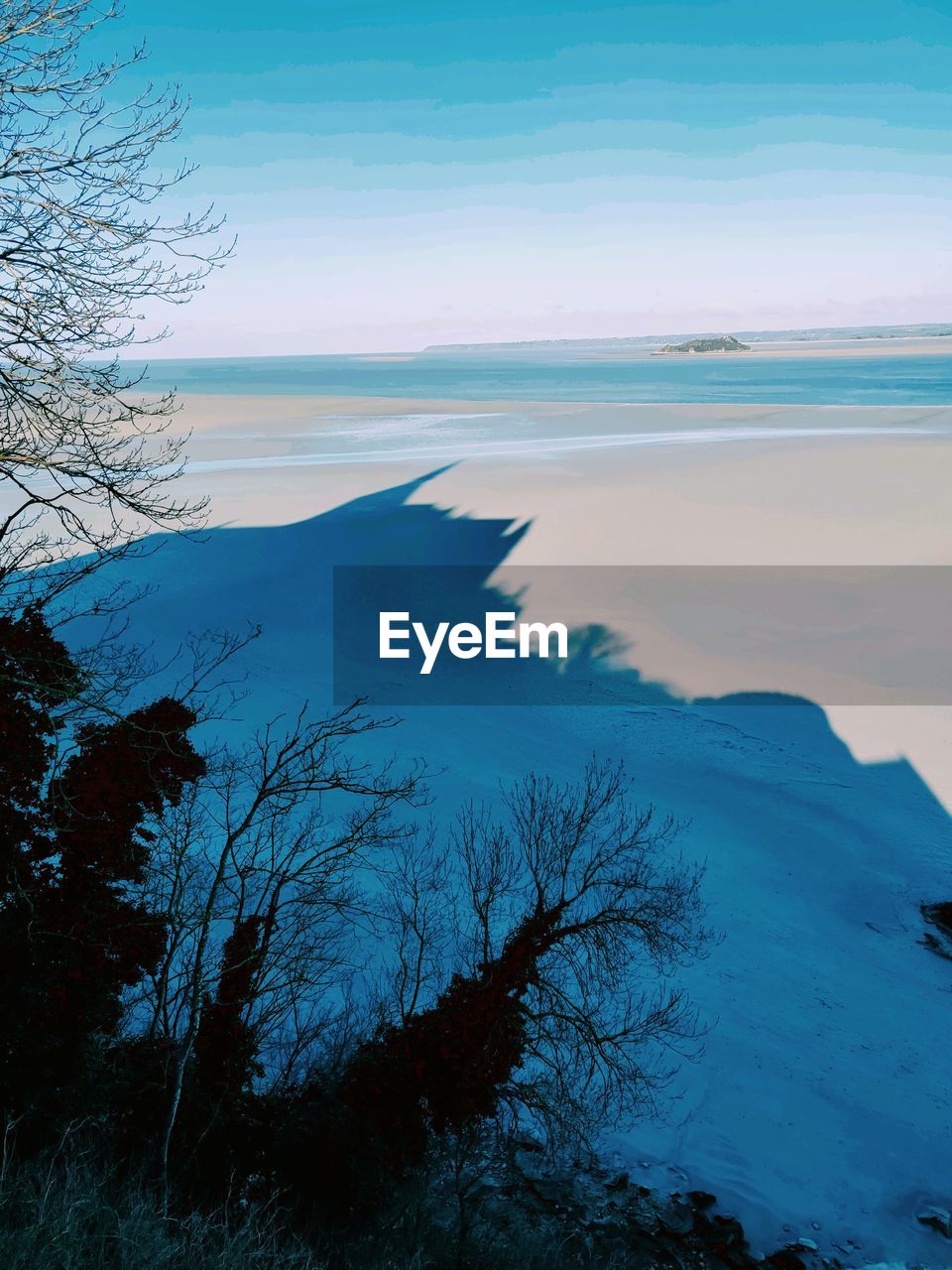 Scenic view of sea against sky during winter