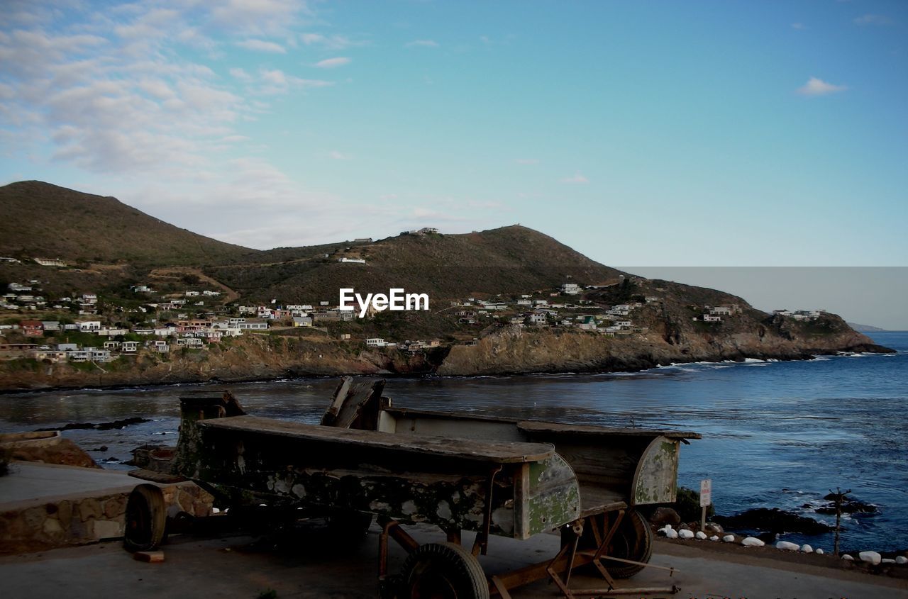 TOWNSCAPE WITH MOUNTAIN RANGE IN BACKGROUND