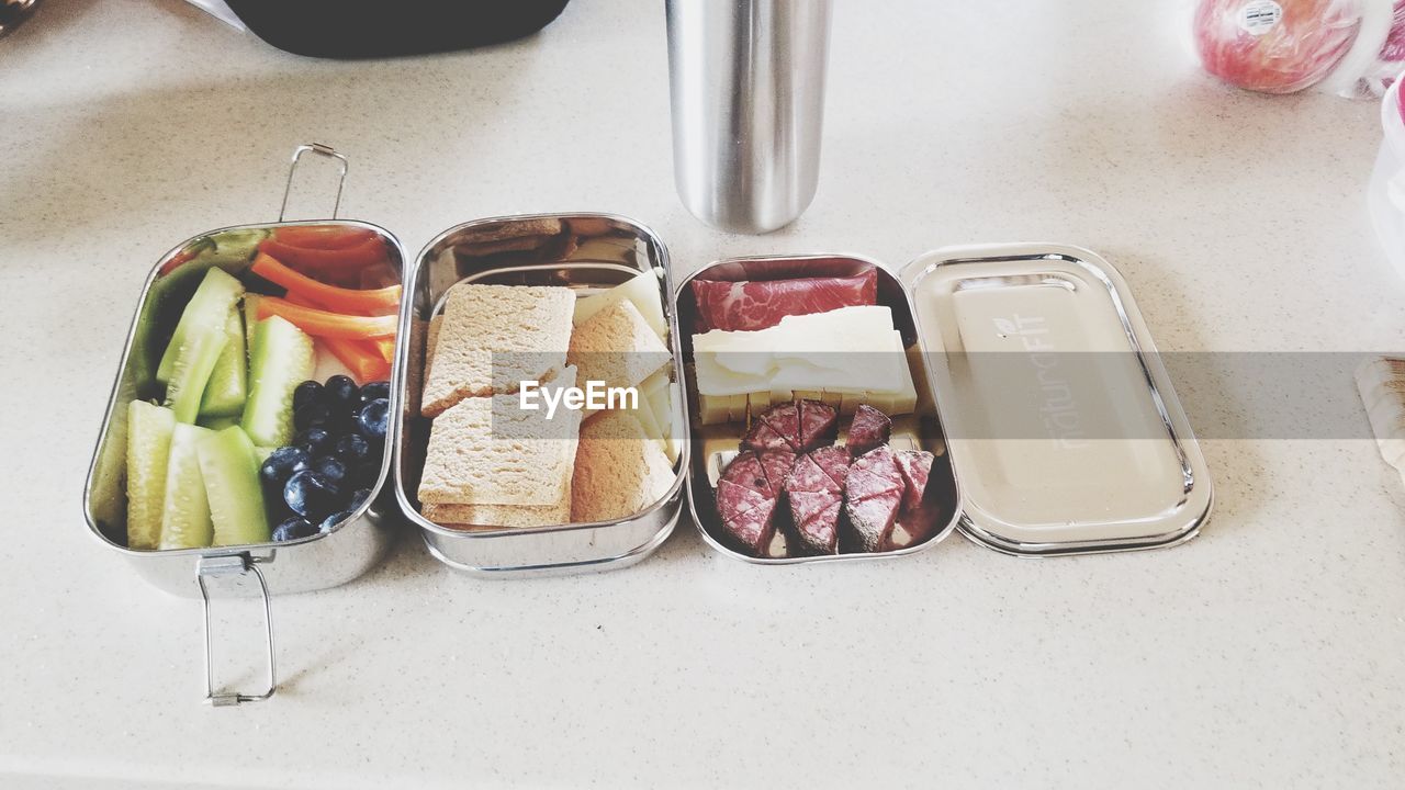 HIGH ANGLE VIEW OF BREAKFAST AND TABLE