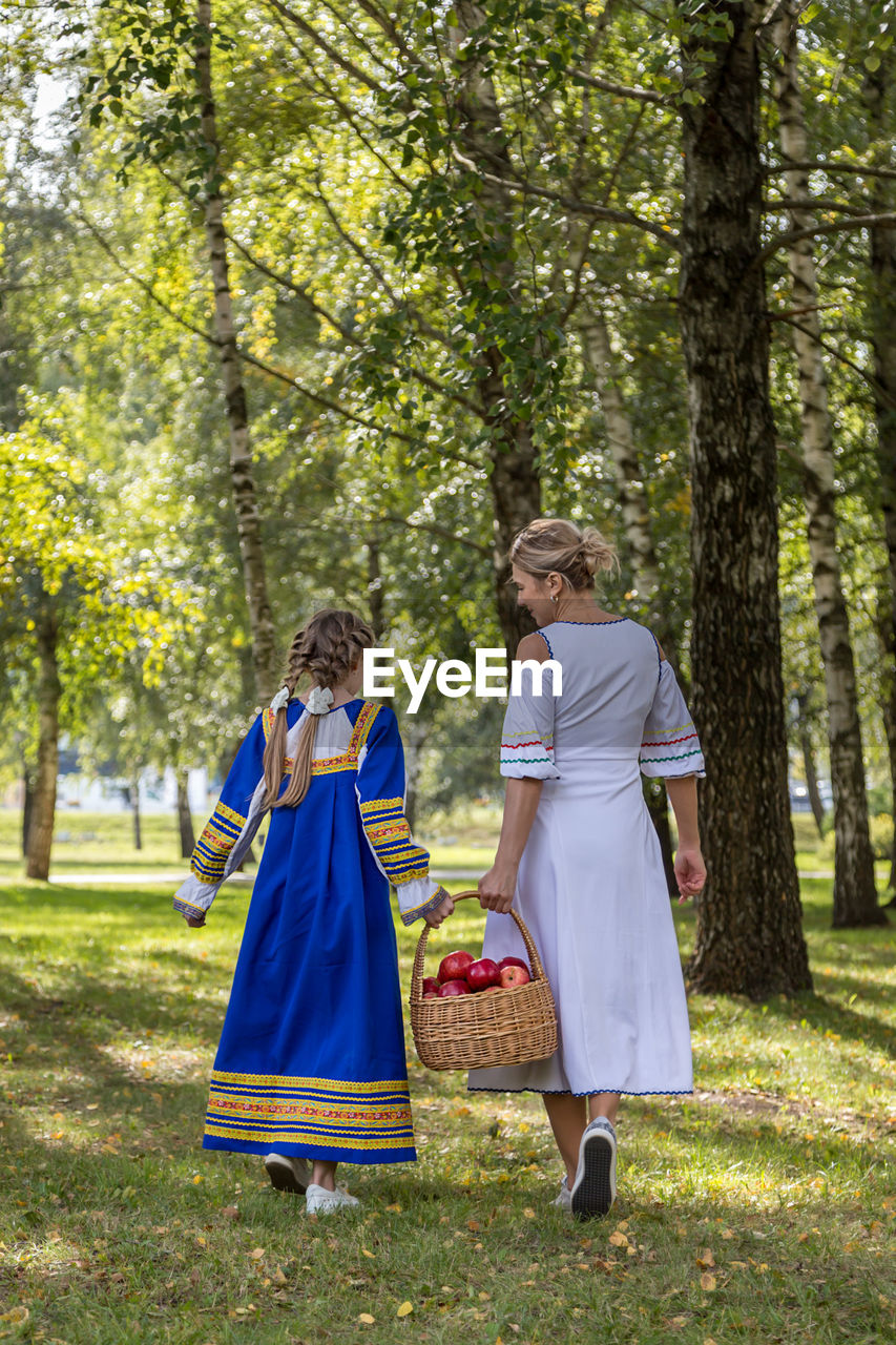 WOMEN WALKING IN FOREST