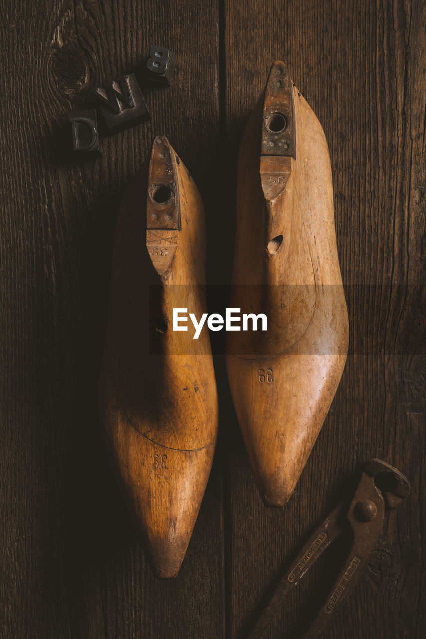 High angle view of shoes on wooden table