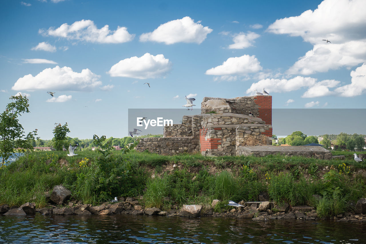 VIEW OF CASTLE AGAINST CLOUDY SKY