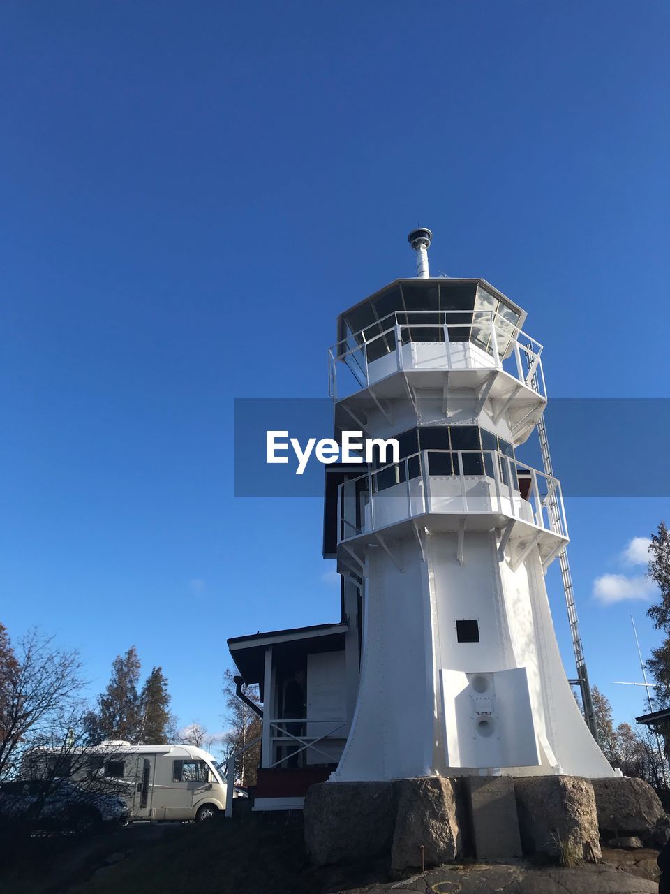 Low angle view of light house against sky 