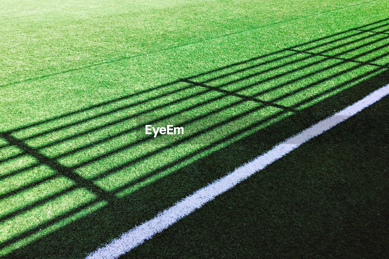 High angle view of shadow pattern on playing field