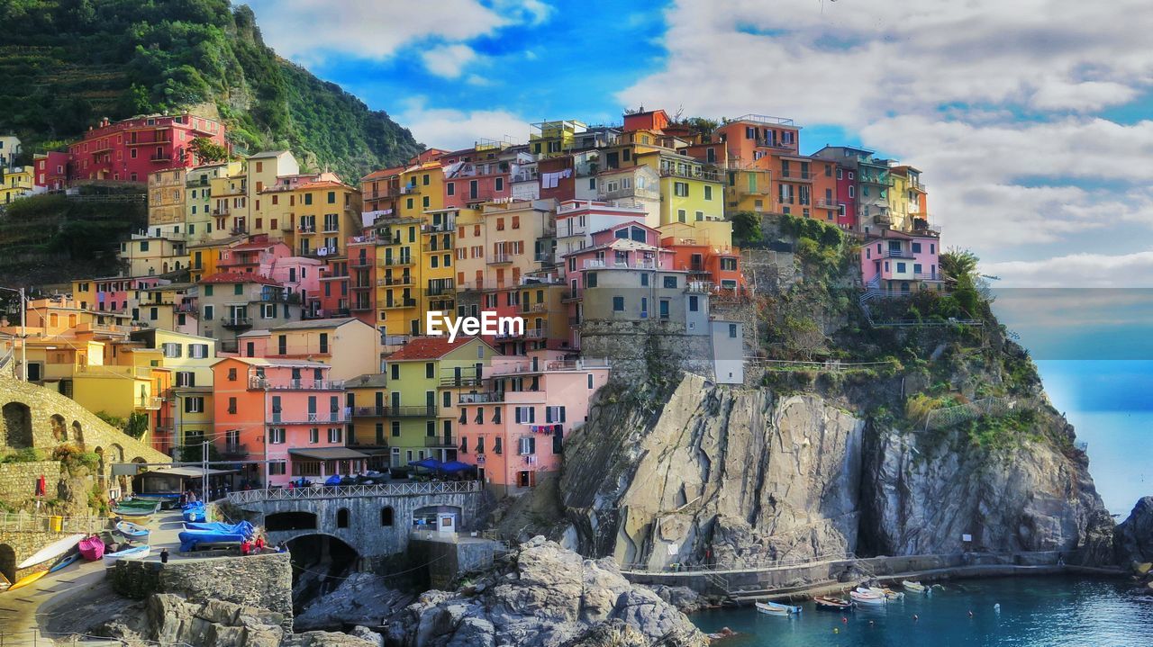 Multi colored houses at cinque terre against sky