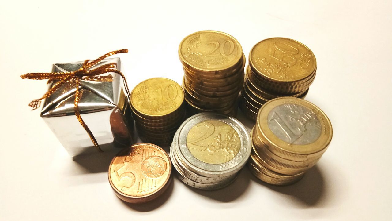 CLOSE-UP OF COINS ON TABLE