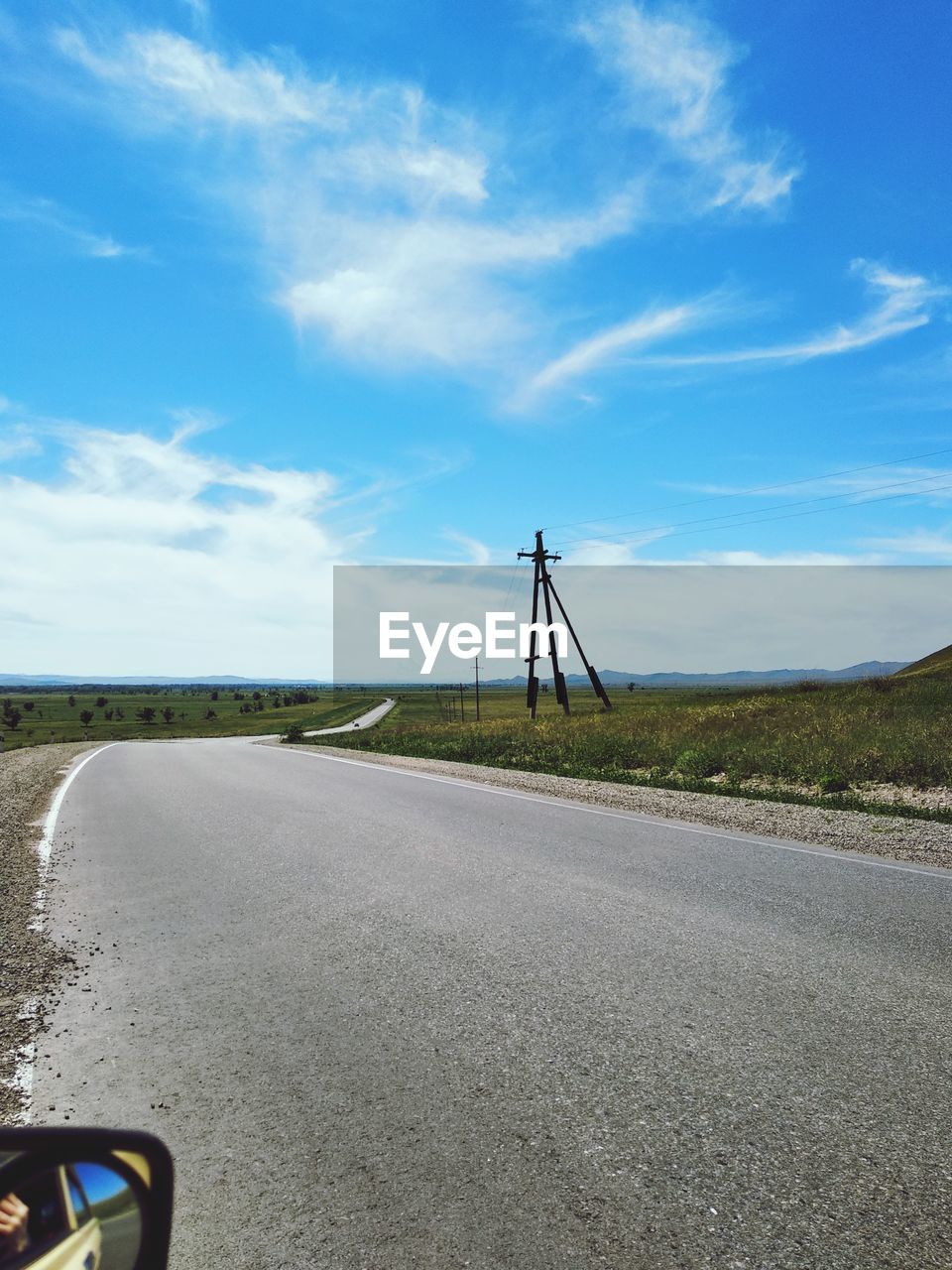 ROAD BY LAND AGAINST SKY