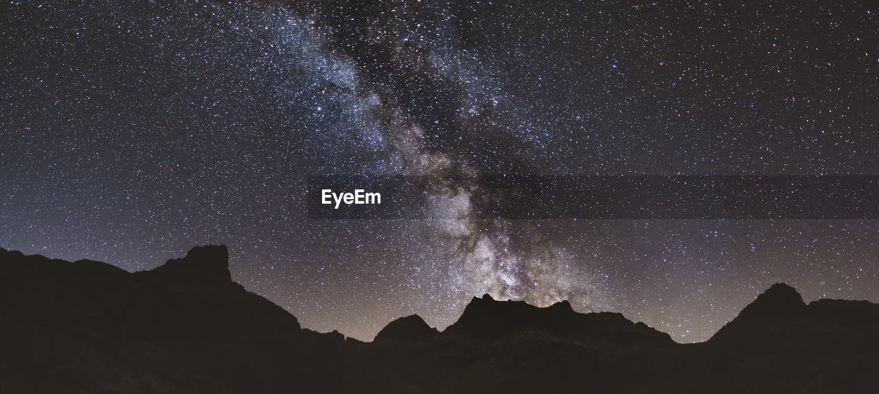 Milky way and its core over the mountains at sierra de gredos, spain