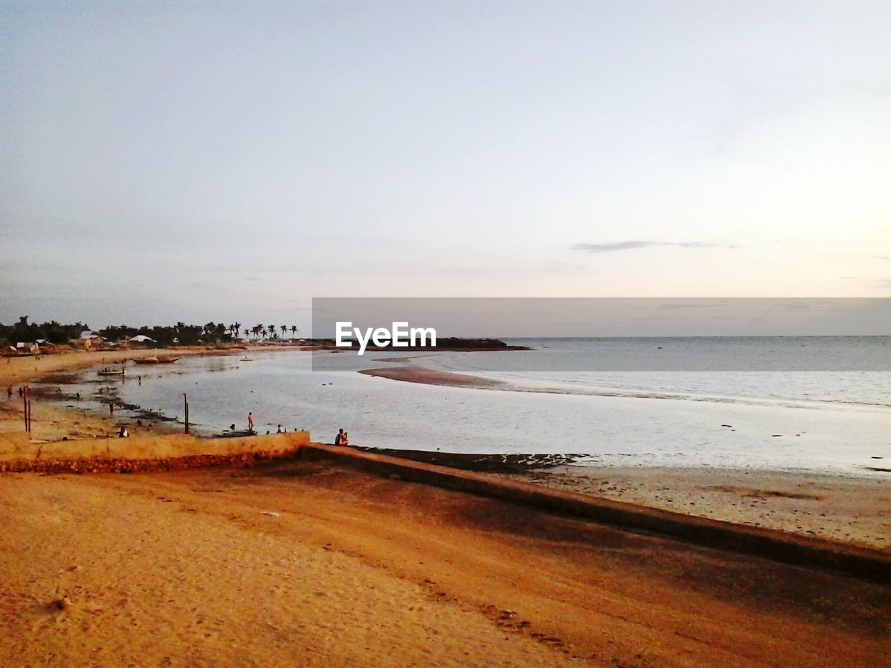 View of beach by sea against sky