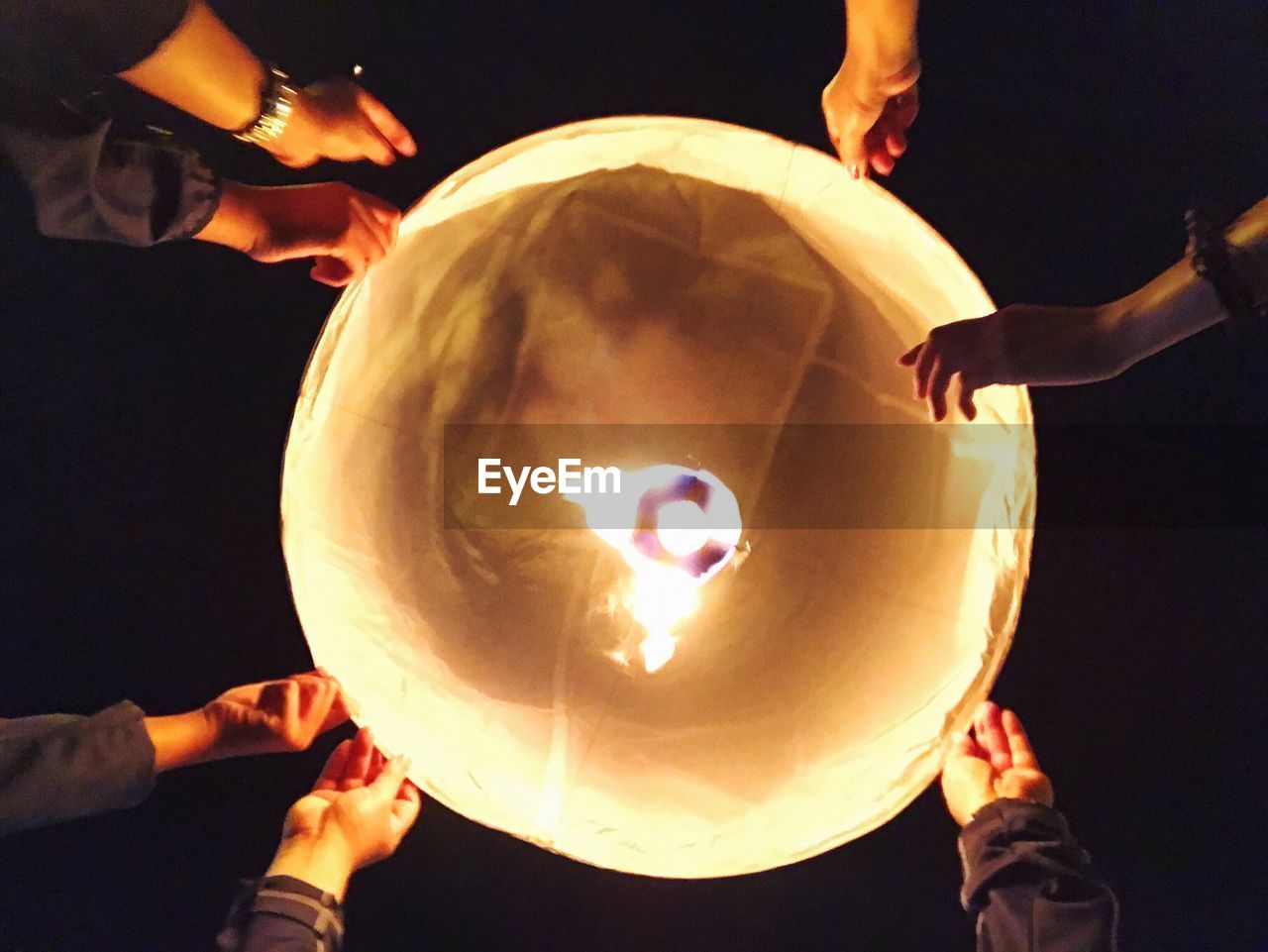 People holding balloon