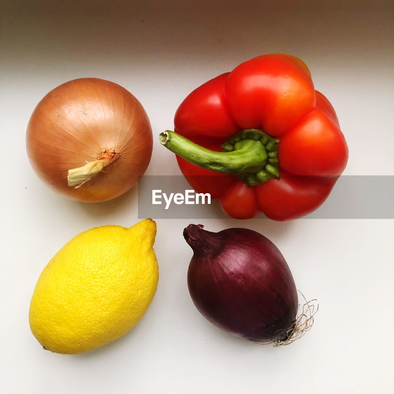 CLOSE-UP OF FRUITS AND TOMATOES ON WHITE BACKGROUND