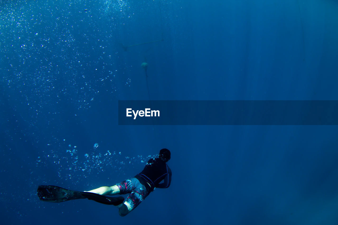 Man swimming in sea