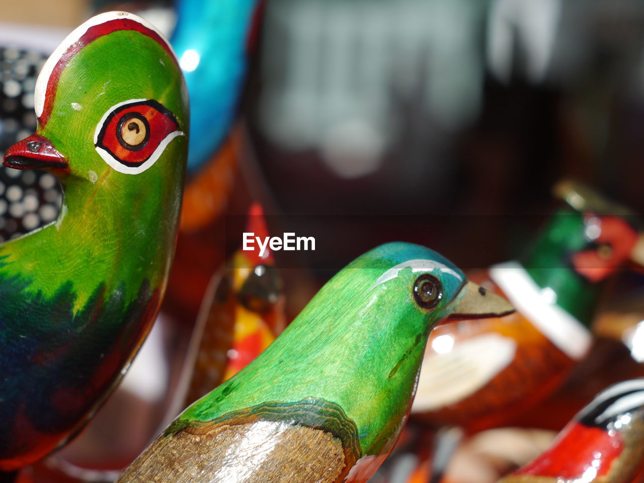 Bird figurines for sale at market stall