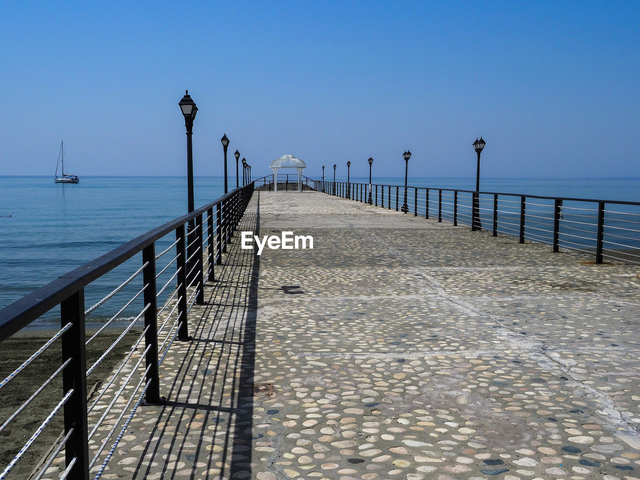 Pier over sea against clear sky